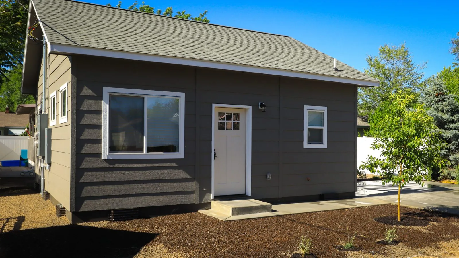 The Wave House ADU exterior in dark grey siding